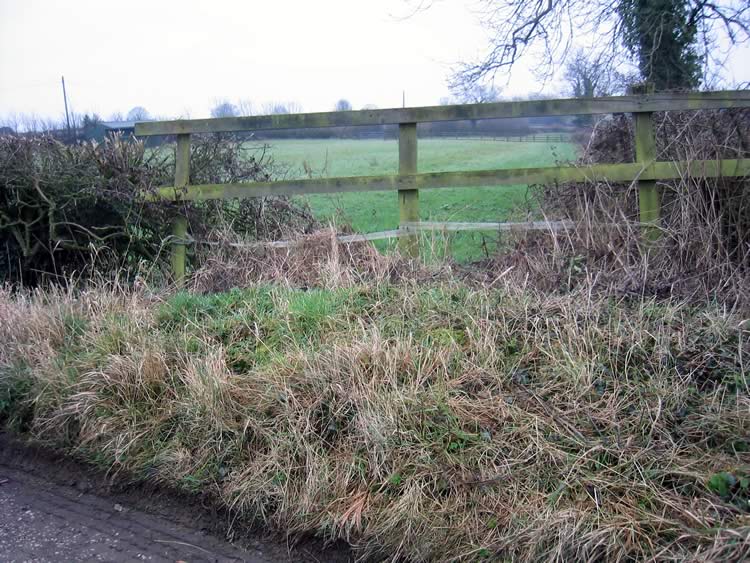 Photograph: 2009: Walker must climb fence